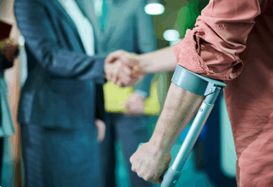 Image of a person who has been injured shaking hands with an attorney